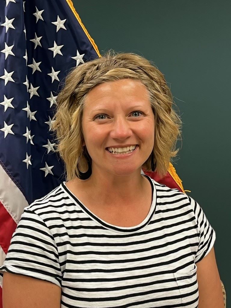 Sarah Biermann smiling with American flag