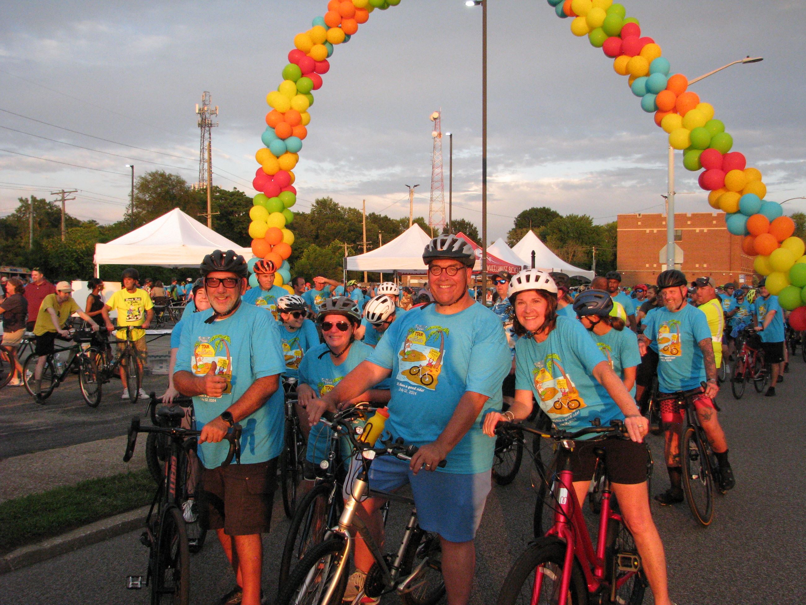 Founders of Tour de Belleville on bikes wearing blue t-shirts