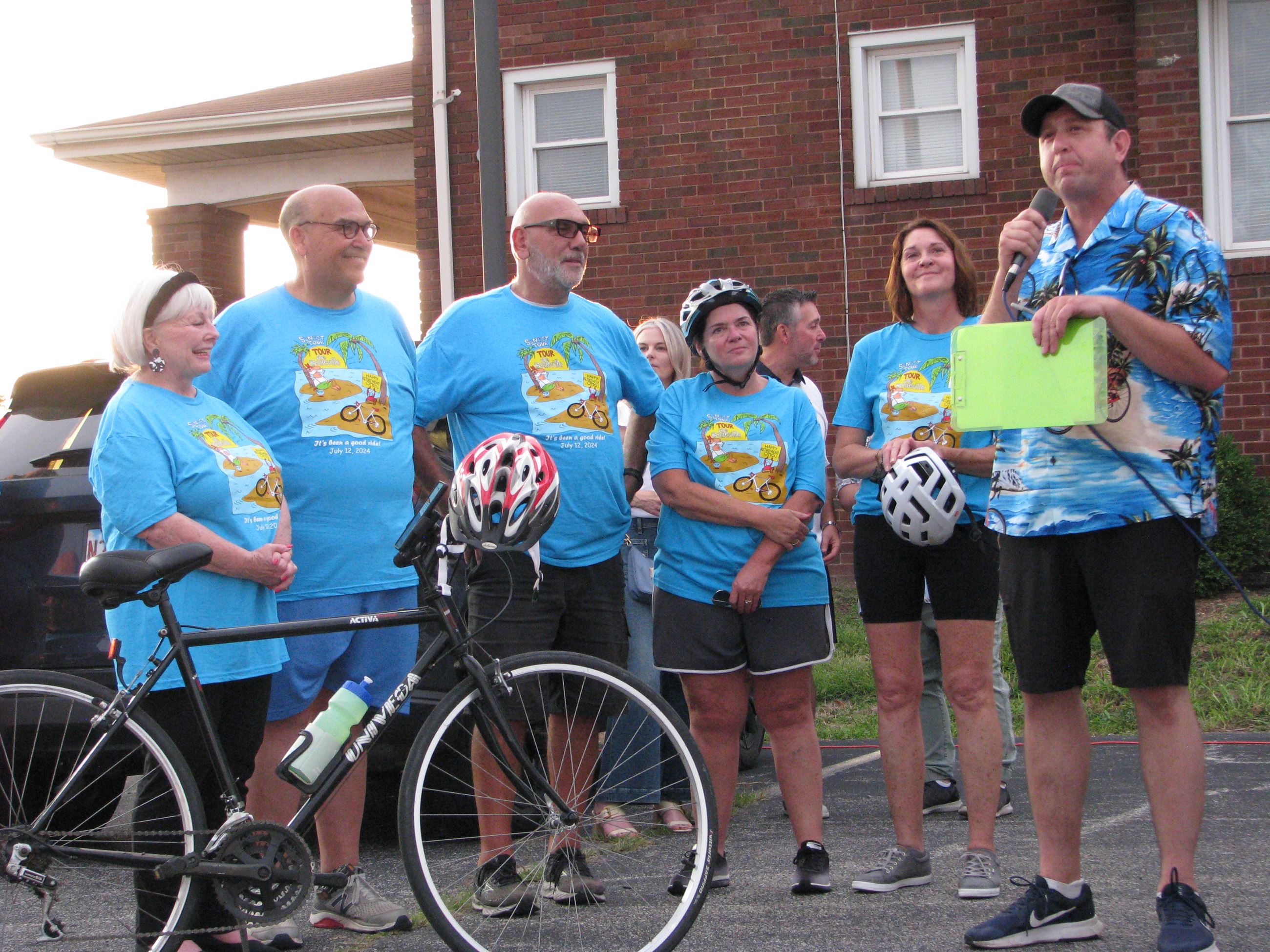 Jason Poole speaks before the Tour de Belleville with founders